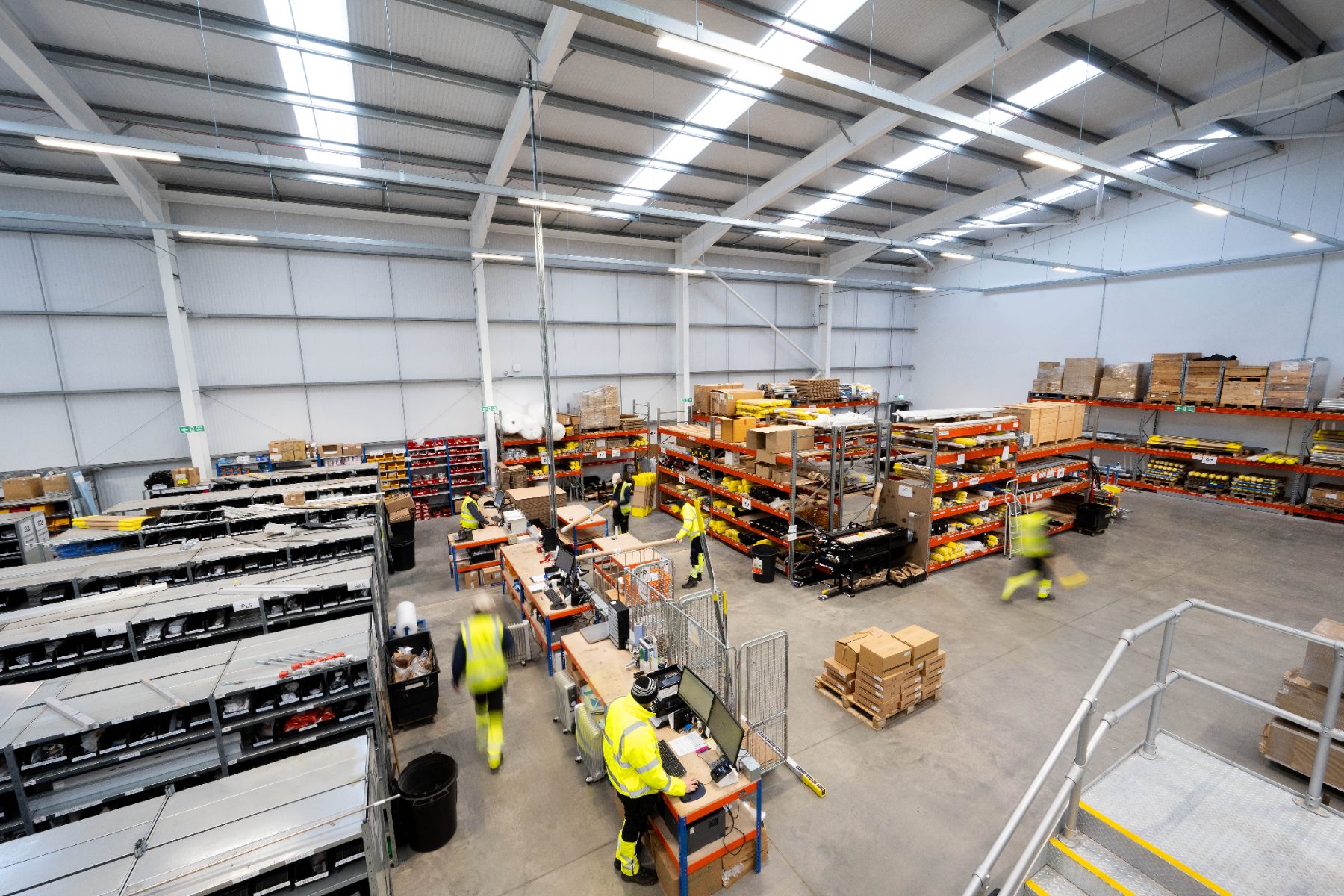 MVS Distribution parts warehouse with staff picking stock from racking